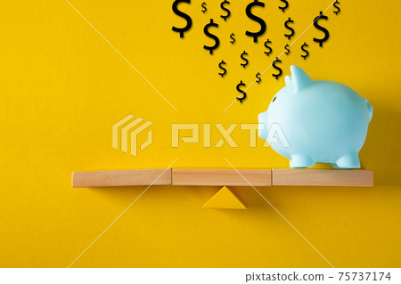 Piggy bank with saving idea on yellow background Piggy bank with saving idea on yellow background 75737174