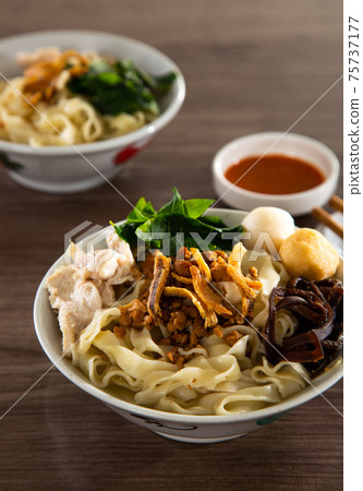 Malaysia hawker food - Pan Mee is made with a simple flour-based dough with anchovy broth Malaysia hawker food - Pan Mee is made with a simple flour-based dough with anchovy broth 75737177