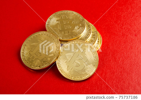 A close up on bitcoin on red background A close up on bitcoin on red background 75737186