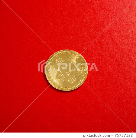 A close up on bitcoin on red background A close up on bitcoin on red background 75737188
