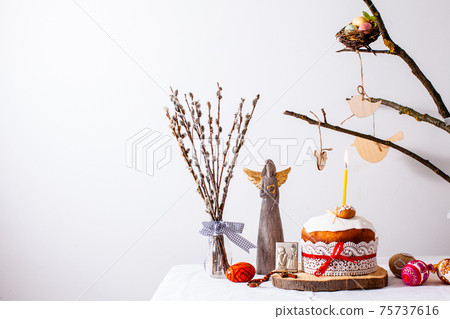 Easter cake and colored eggs on white background Easter cake and colored eggs on white background 75737616