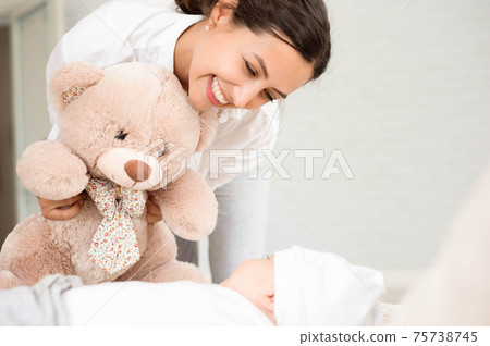 Happy loving family. Mother and her son child boy playing and hu 75738745