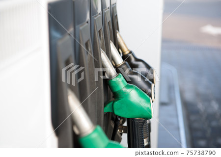 Green and yellow colorful fuel, gas station. Gas station in operation. Green and yellow colorful fuel, gas station. Gas station in operation. 75738790