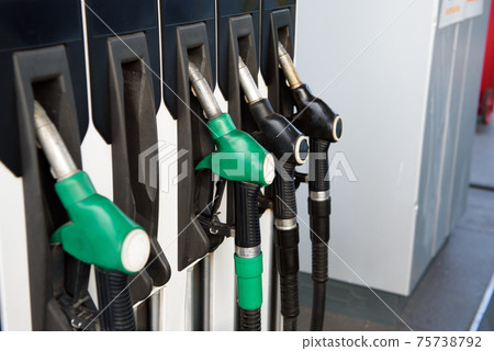 Green and yellow colorful fuel, gas station. Gas station in operation. Green and yellow colorful fuel, gas station. Gas station in operation. 75738792