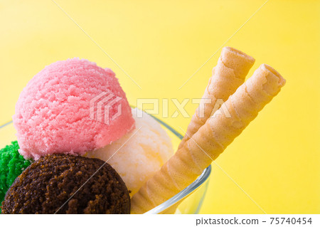 Ice cream scoops in crystal bowl Ice cream scoops in crystal bowl 75740454
