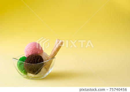 Ice cream scoops in crystal bowl Ice cream scoops in crystal bowl 75740456