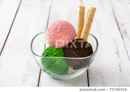 Ice cream scoops in crystal bowl Ice cream scoops in crystal bowl 75740458