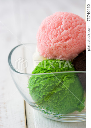 Ice cream scoops in crystal bowl Ice cream scoops in crystal bowl 75740460