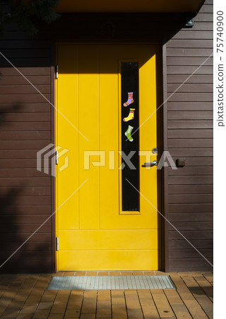 Paper socks of different colors hang on the door. World Down Syndrome Day. Paper socks of different colors hang on the door. World Down Syndrome Day. 75740900