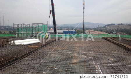 SEREMBAN, MALAYSIA - AUGUST 2, 2016: Timber formwork and steel reinforcement bar fabricated by construction workers at the construction site  75741713