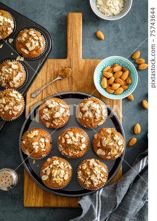 Healthy gluten free almond muffins with nut slices 75743644