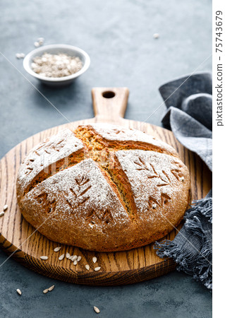 Homemade yeast free wholegrain rye bread with sunflower seeds Homemade yeast free wholegrain rye bread with sunflower seeds 75743679