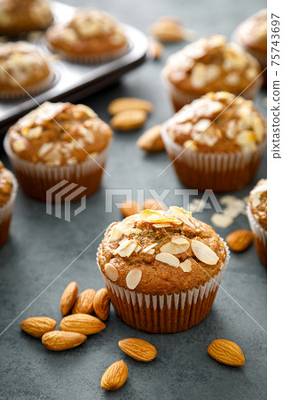 Healthy gluten free almond muffins with nut slices Healthy gluten free almond muffins with nut slices 75743697