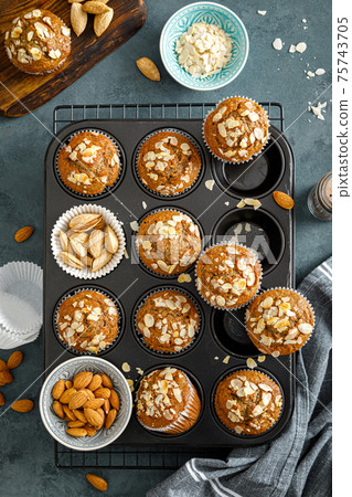 Healthy gluten free almond muffins with nut slices 75743705