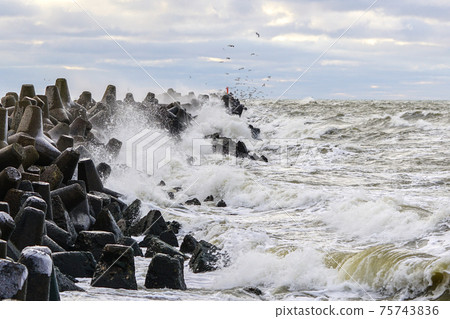 Stormy Baltic sea, port entrance breakwater, Liepaja, Latvia Stormy Baltic sea, port entrance breakwater, Liepaja, Latvia 75743836