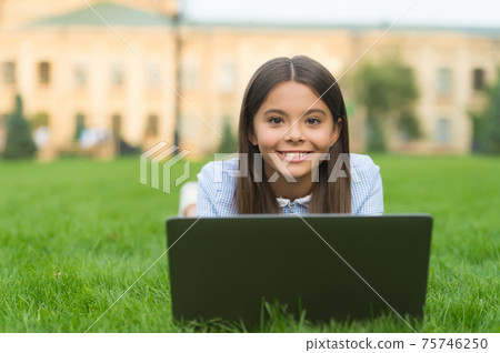 kid learning private lesson. blogging. happy girl sitting 75746250