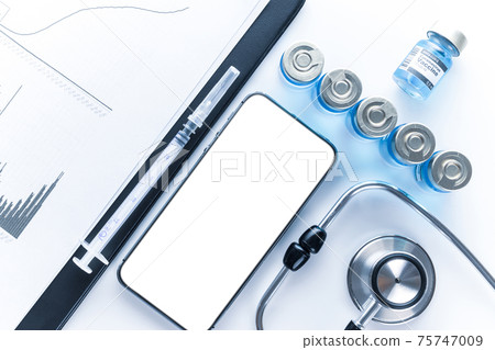 Medical application. Hospital equipment: doctor stethoscope, healthcare charts, syringe with needle and black smartphone with blank screen. Mockup generic device. Medical application. Hospital equipment: doctor stethoscope, healthcare charts, syringe with needle and black smartphone with blank screen. Mockup generic device. 75747009