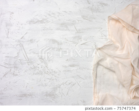 white textile kitchen napkin on gray cement background 75747374