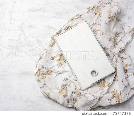 rectangular white cutting board on white textile tablecloth rectangular white cutting board on white textile tablecloth 75747376