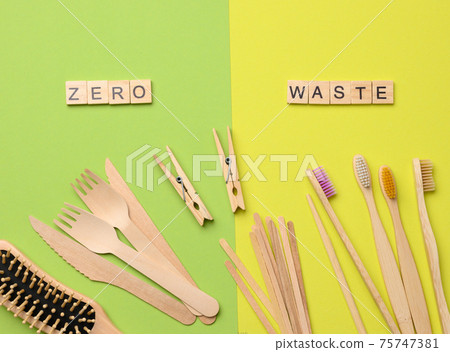 toothbrush, comb, clothespin and other wooden items on green background toothbrush, comb, clothespin and other wooden items on green background 75747381