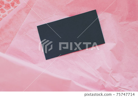 Black business card flatlay on pink tissue paper background, luxury branding flat lay and brand identity design for mockup 75747714