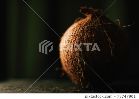 Coconut on dark background, food and nature Coconut on dark background, food and nature 75747901