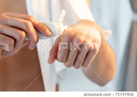 hand care cosmetic product man applying cream tube 75747956