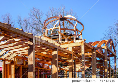 new wooden building frame with a round domed tower new wooden building frame with a round domed tower 75748540