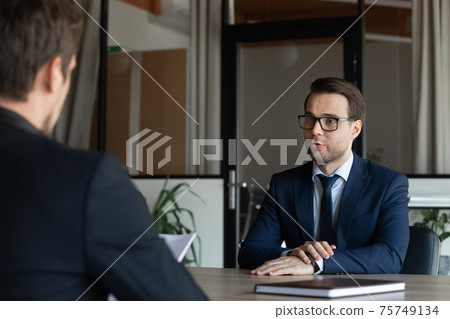 Caucasian male employee talk with employer at interview 75749134