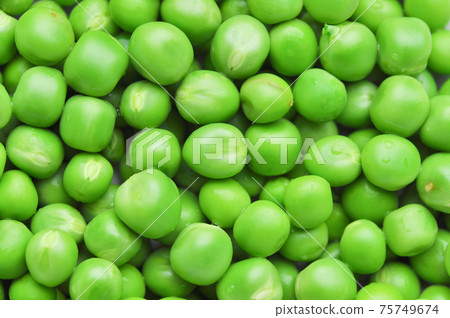 Green peas background texture. Green peas background texture. 75749674