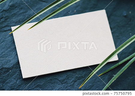White business card flatlay on dark stone background and green exotic leaf, luxury branding flat lay and brand identity design for mockup 75750795