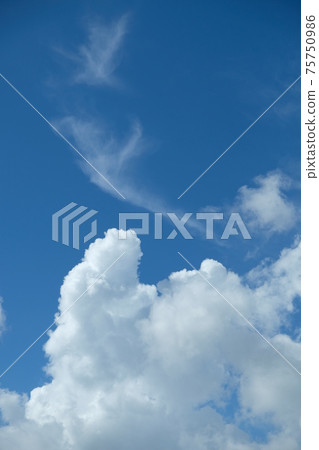 White clouds floating in the blue sky White clouds floating in the blue sky 75750986