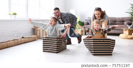 Optimistic family having fun during relocation in new flat Optimistic family having fun during relocation in new flat 75751197