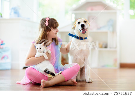 Child playing with dog. Kids play with puppy. Child playing with dog. Kids play with puppy. 75751657
