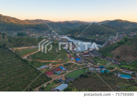 Aerial view of Ban Rak Thai village, chinese hotel resort, Mae Hong Son, Thailand. Nature landscape in travel trip and vacation. Aerial view of Ban Rak Thai village, chinese hotel resort, Mae Hong Son, Thailand. Nature landscape in travel trip and vacation. 75756980
