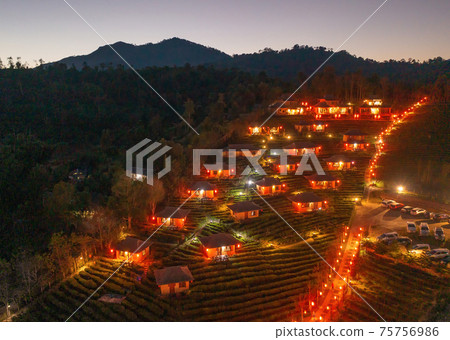 Aerial view of Ban Rak Thai village, chinese hotel resort at night, Mae Hong Son, Thailand. Nature landscape in travel trip and vacation. 75756986