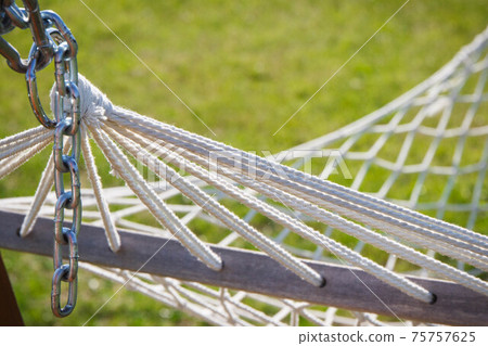 Grid rope as part of hammock. Vacation and summer time 75757625