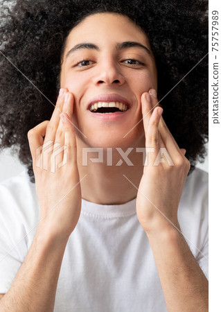 man facial care skin treatment guy touching face 75757989
