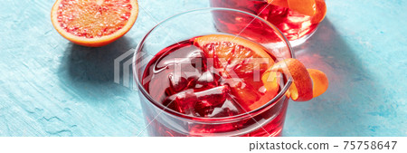 Cocktail panorama with blood oranges on blue Cocktail panorama with blood oranges on blue 75758647