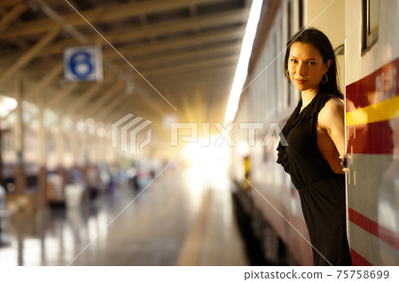 LGBT Transgender model travels on train at station railway LGBT Transgender model travels on train at station railway 75758699