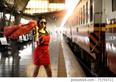 LGBT Transgender model travels on train at station railway LGBT Transgender model travels on train at station railway 75758711