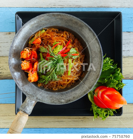 Funchosa with shrimps and vegetable in a frying pan Funchosa with shrimps and vegetable in a frying pan 75758760