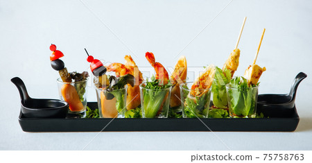 Vegetable snacks with shrimps and meat in shot glass Vegetable snacks with shrimps and meat in shot glass 75758763