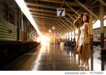 Young model travels on train at station railway in Summer Young model travels on train at station railway in Summer 75758887
