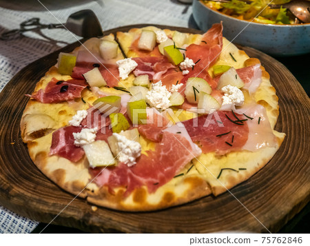Flatbreads fresh from oven in Mediterranean style restaurant Flatbreads fresh from oven in Mediterranean style restaurant 75762846