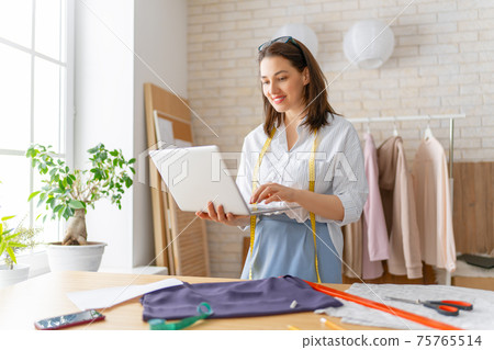 Woman is working at workshop 75765514