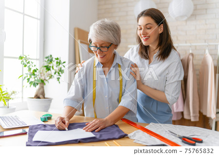 Women are working at workshop 75765832