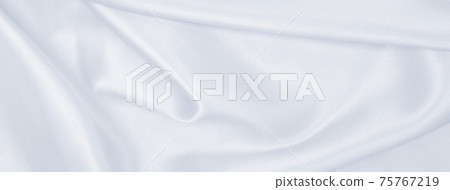 Smooth elegant grey silk or satin luxury cloth as wedding background. Luxurious background design Smooth elegant grey silk or satin luxury cloth as wedding background. Luxurious background design 75767219