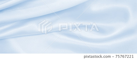Smooth elegant blue silk or satin luxury cloth texture as abstract background. Luxurious background design Smooth elegant blue silk or satin luxury cloth texture as abstract background. Luxurious background design 75767221