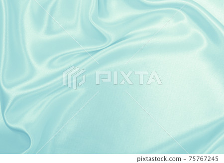 Smooth elegant blue silk or satin luxury cloth texture as abstract background. Luxurious background design Smooth elegant blue silk or satin luxury cloth texture as abstract background. Luxurious background design 75767245